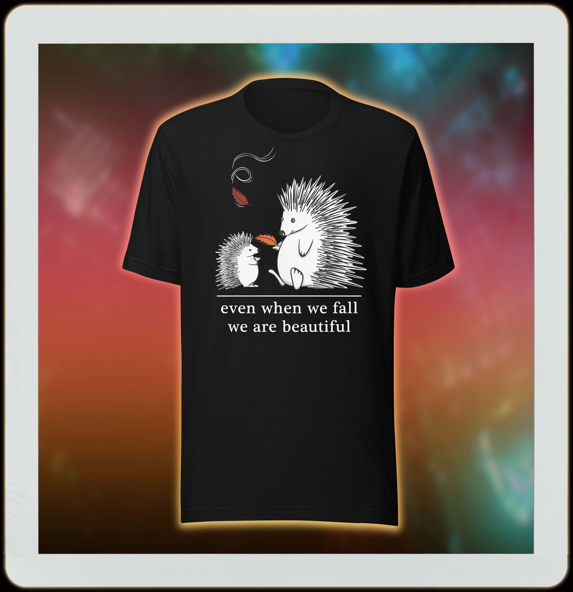 two cute hedgehogs in autumn leaves on black tee