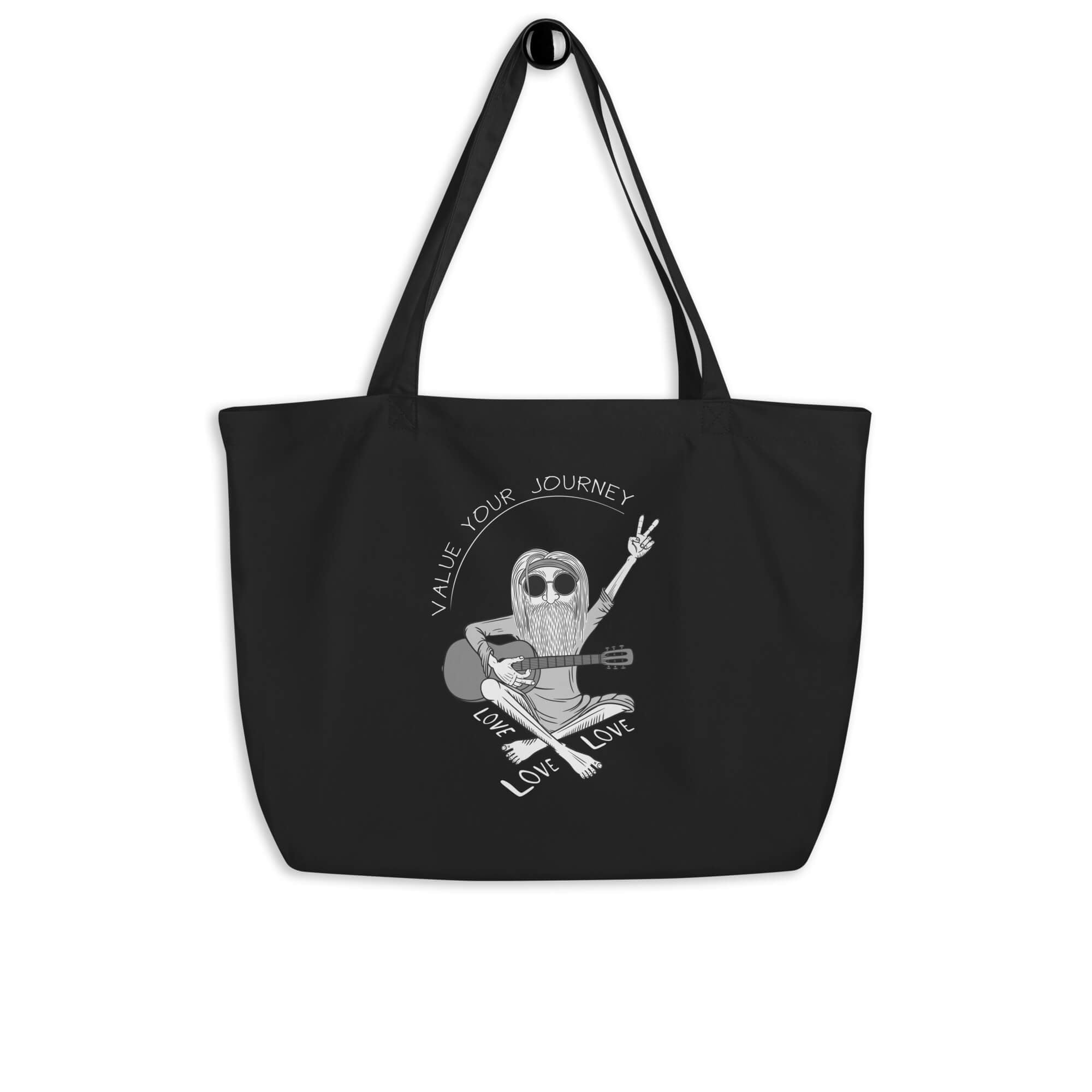 Black tote bag with a drawing of a cartoon hippie and peace symbol