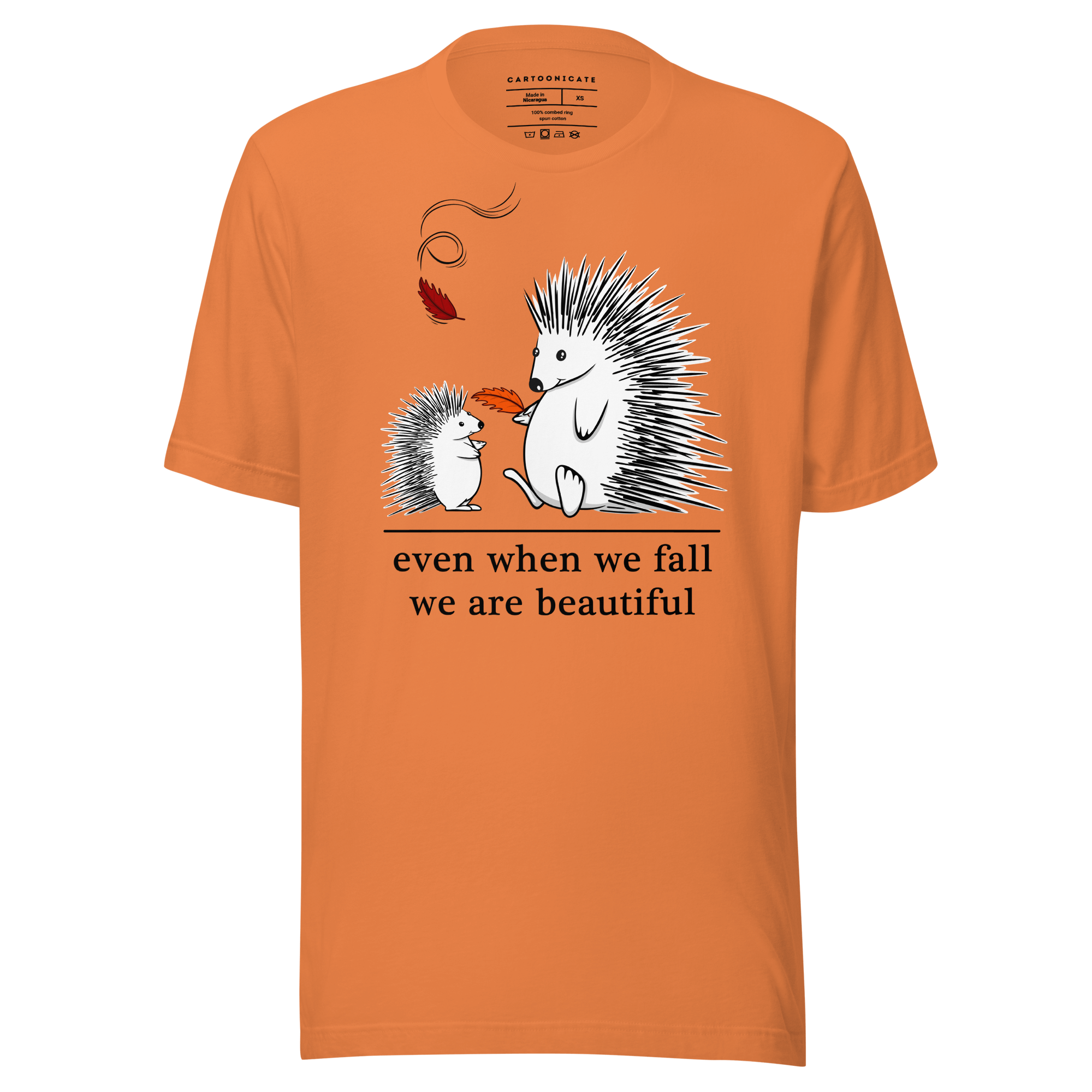 Cartoon drawing of two hedgehogs in autumn on orange tee