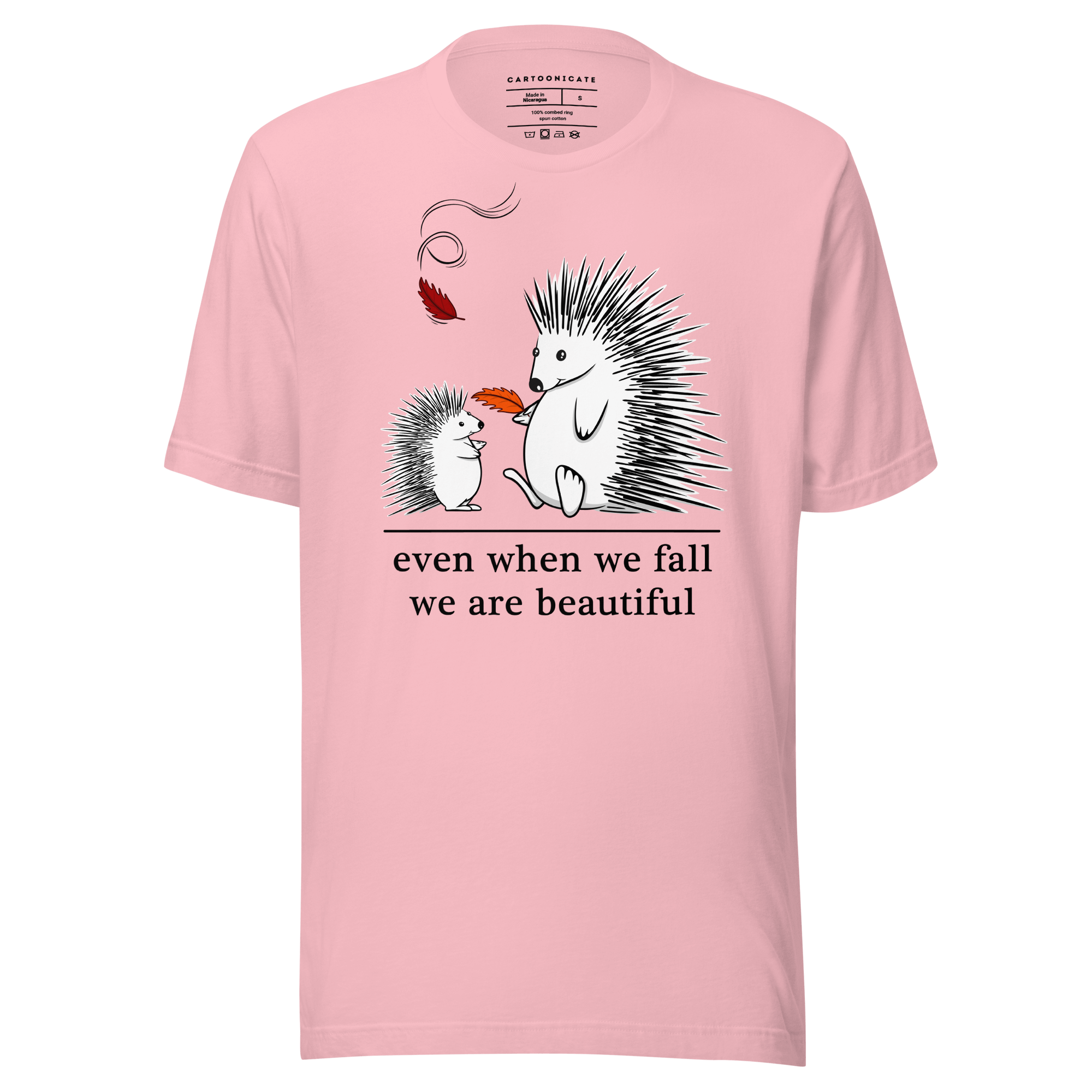 Pink t-shirt with hedgehogs playing with leaves in fall 