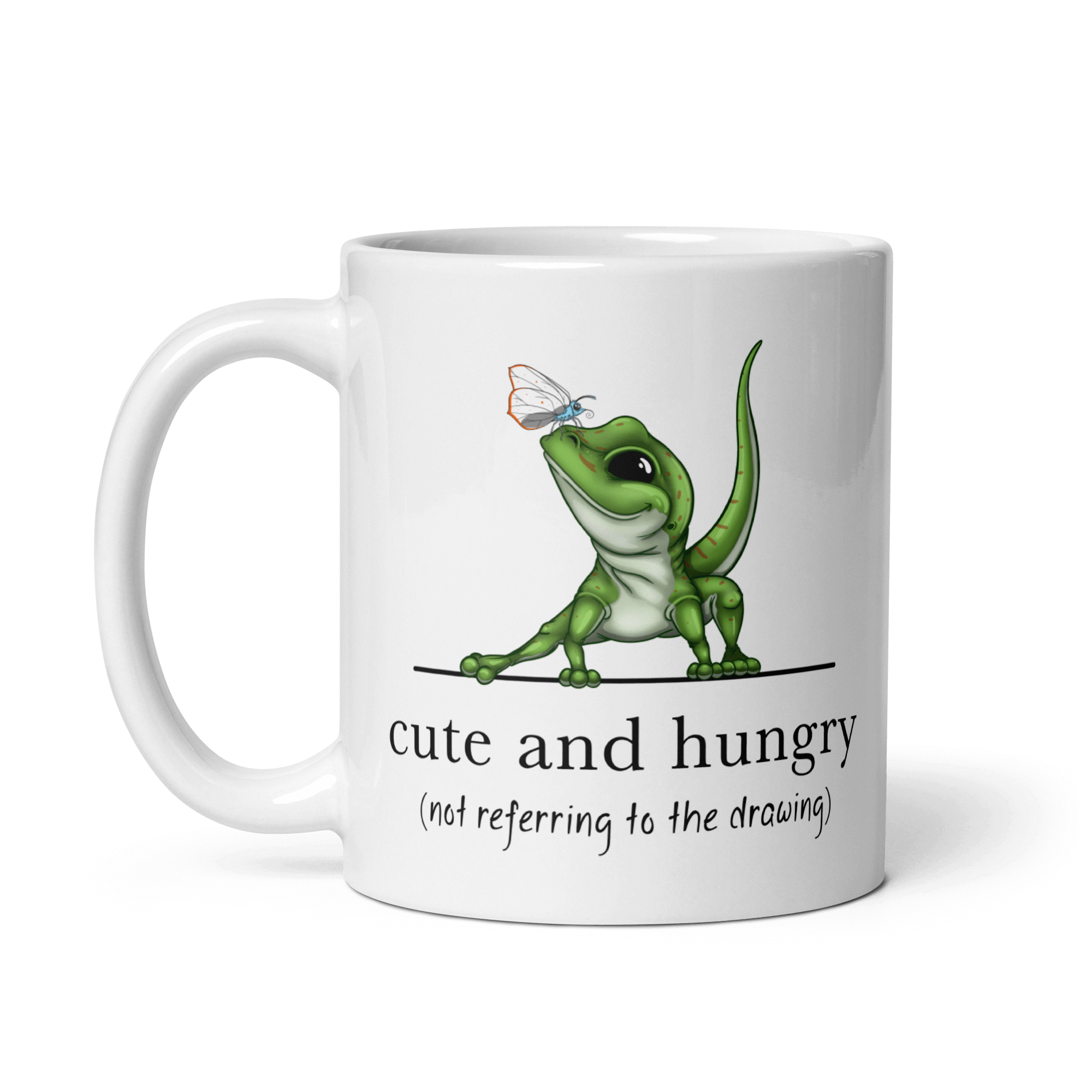 cute and hungry gecko on white ceramic mug