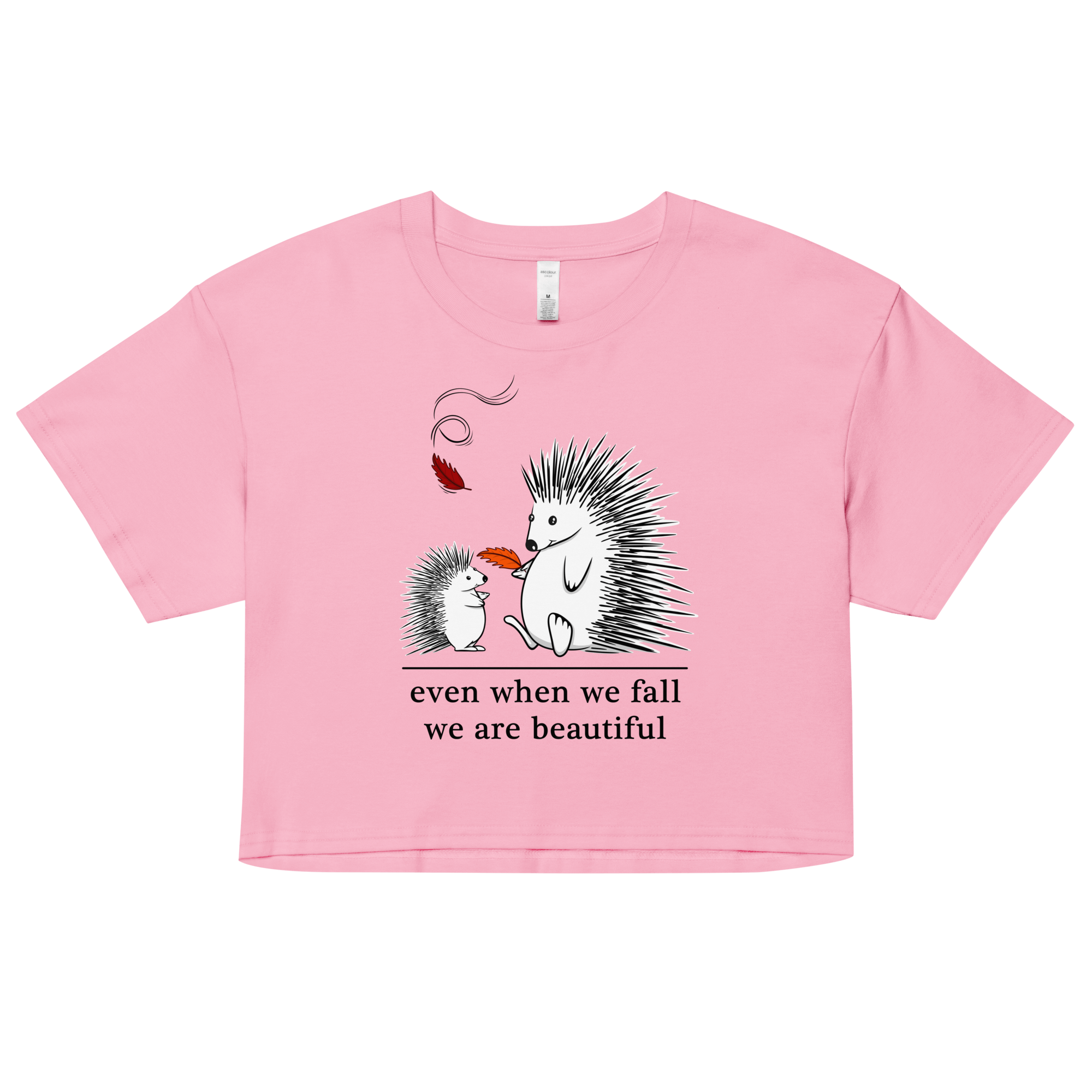 Cartoon drawing of two hedgehogs in autumn on women’s crop top pink