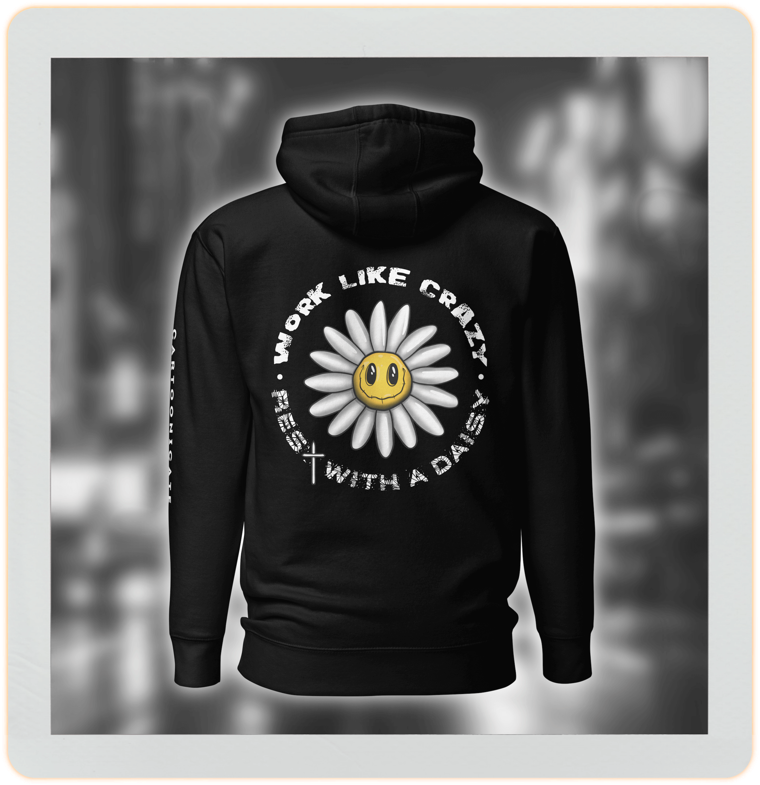 drawing of a funny cartoon daisy flower on black hoodie